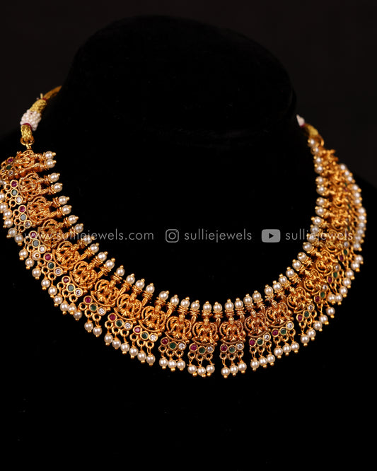 Detailed Lakshmi Design with Pearl drops Necklace Set